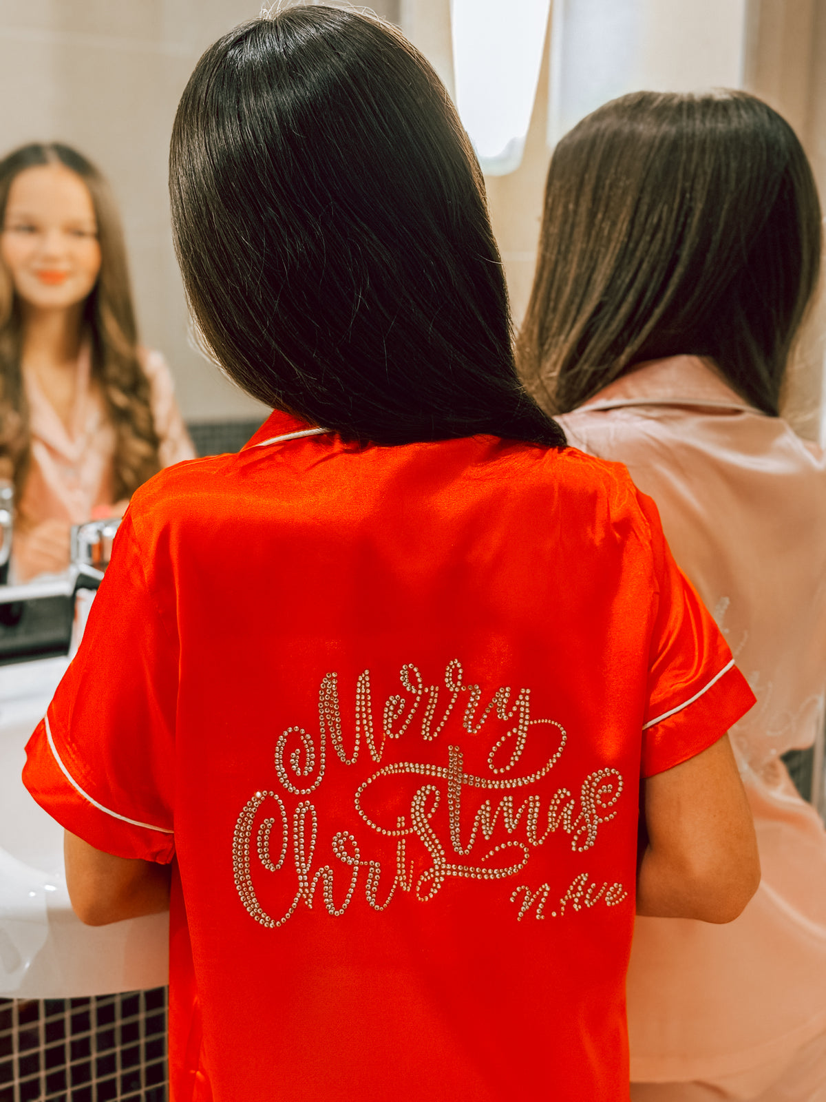 Luxury red satin Christmas short pyjama set with white piping and sparkling crystal rhinestone ‘Merry Christmas’ lettering on the back, by Niamh Avenue.